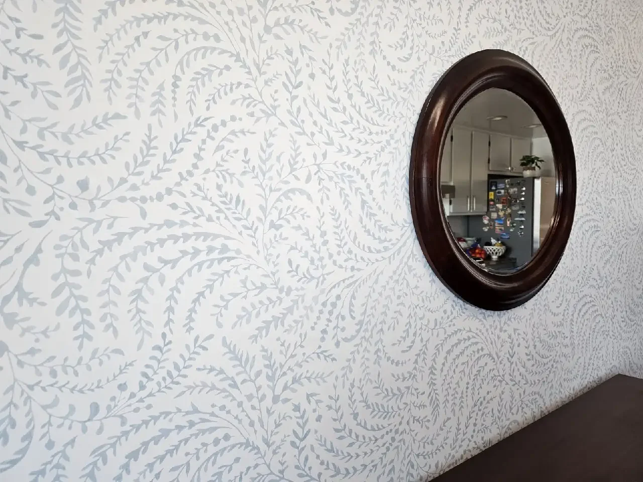 Wallpapered interior with a finished, patterned wall