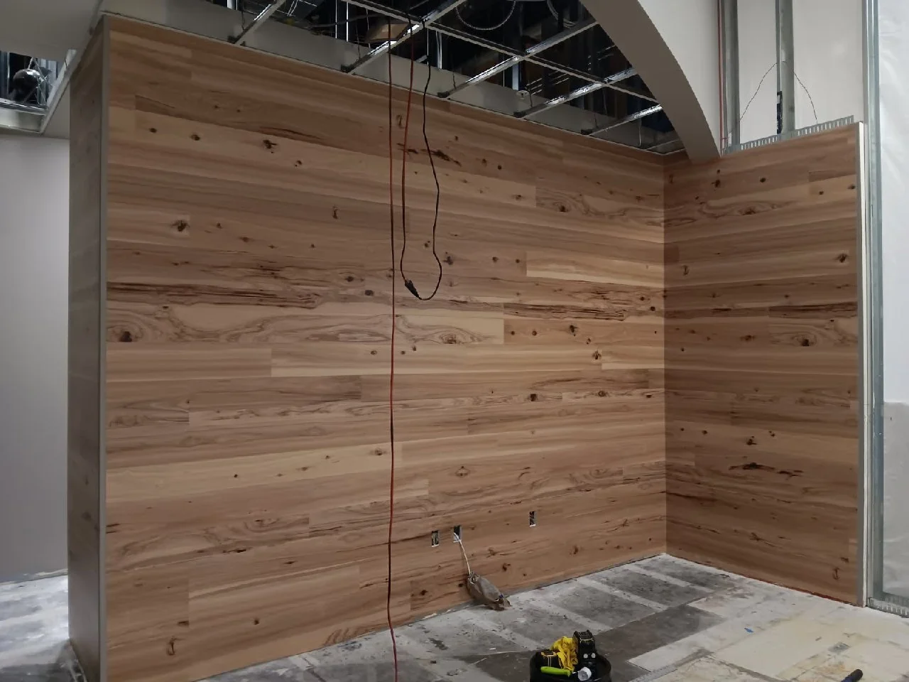 Warm wood-look wallcovering in a finished interior
